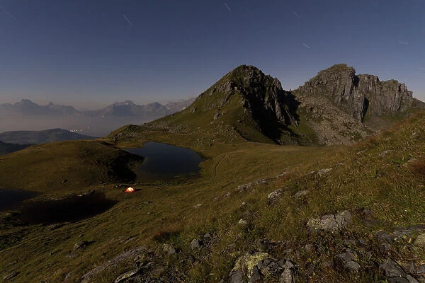Night shot, Lake Berglimattsee with illuminated tent, Glarus Alps, Canton Glarus, Switzerland, Europe