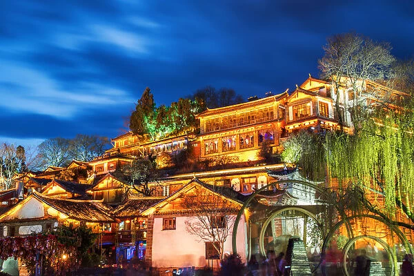 Night view of traditional Chinese wooden building in the Old Town of Lijiang, Yunnan province, China. The Old Town of Lijiang is a popular tourist destination of Asia