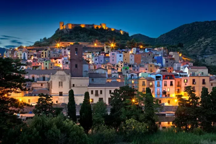 Framed Print : Nighttime view over the colourful town of Bosa and its medieval castle along the Temo Framed Print : Nighttime view over the colourful town of Bosa and its medieval castle along the Temo