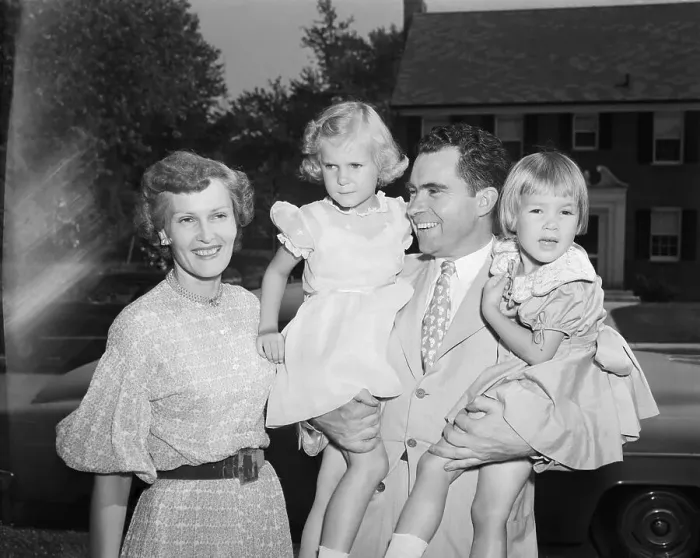 Framed Print : Nixon Hugging Daughters