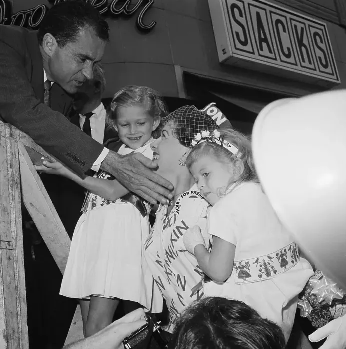 Framed Print : Nixon Pats Womans Cheek While Kids Watch Framed Print : Nixon Pats Womans Cheek While Kids Watch