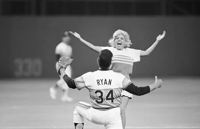 Framed Print : Nolan Ryan About To Hug Woman On Field