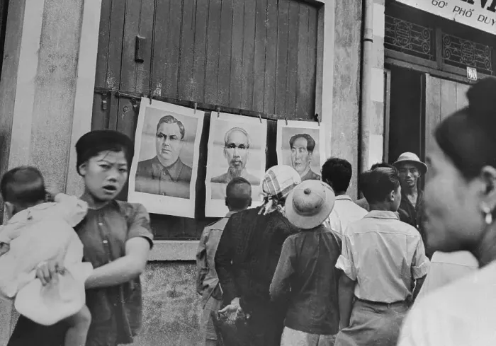 Framed Print : North Vietnamese Looking at Portraits of Communist Leaders