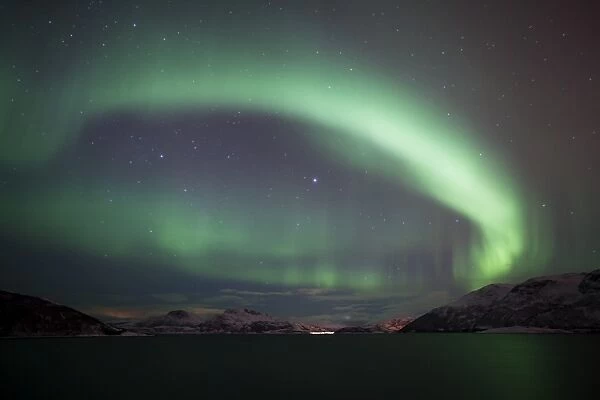 Northern Lights over the Grotfjord in winter, Kvaloya, Tromso, Norway, Europe
