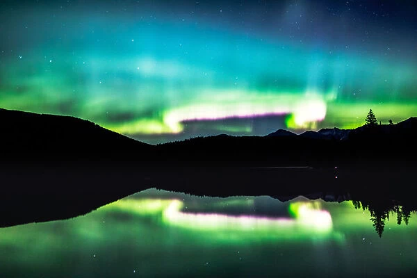Northern lights reflection in a lake, Jasper, Canada