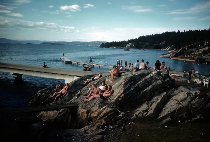 Framed Print : NORWAY - JULY 1946: A view as couples sunbathe on a rock in Norway Framed Print : NORWAY - JULY 1946: A view as couples sunbathe on a rock in Norway
