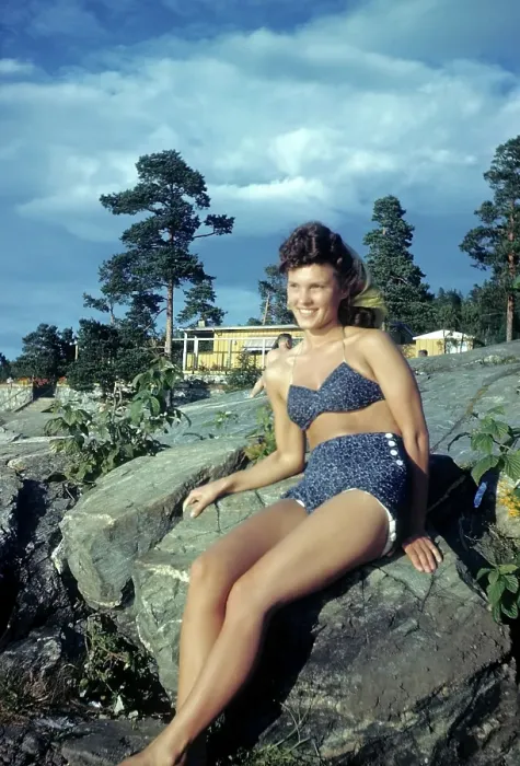 Framed Print : NORWAY - JULY 1946: A young women sunbathes on a rock in Norway Framed Print : NORWAY - JULY 1946: A young women sunbathes on a rock in Norway