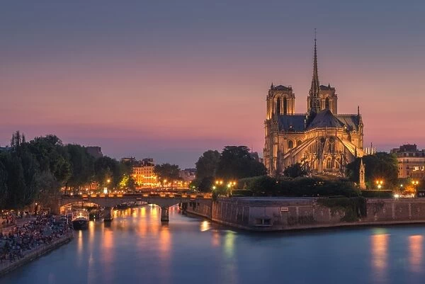 Notre dame at night with city light