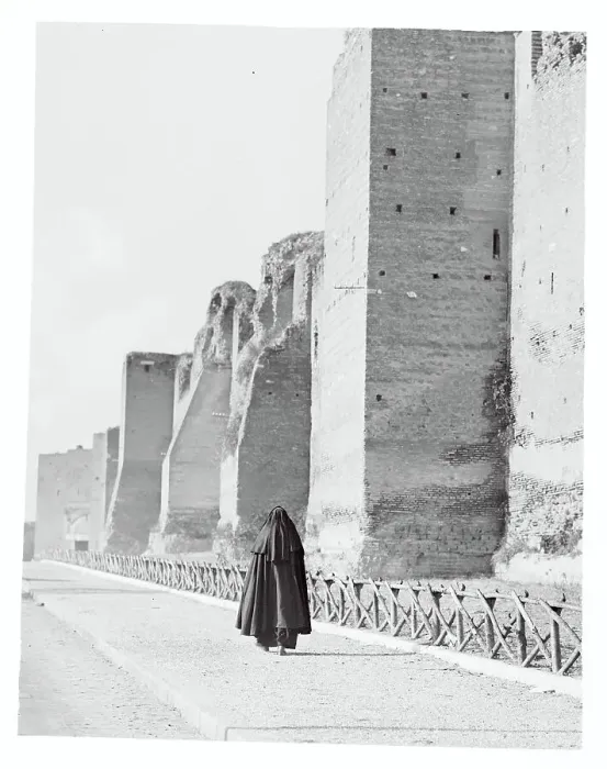 Framed Print : Nun Passing the Roman Wall Framed Print : Nun Passing the Roman Wall