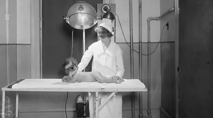 Framed Print : Nurse With Apparatuses by Table With Infant Framed Print : Nurse With Apparatuses by Table With Infant