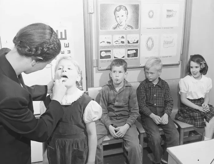 Framed Print : Nurse Checking Nursery Schooler's Teeth Framed Print : Nurse Checking Nursery Schooler's Teeth