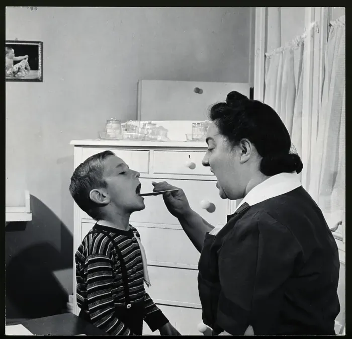 Framed Print : Nurse Examining Child Framed Print : Nurse Examining Child