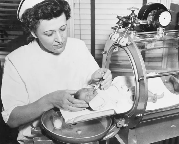 Framed Print : Nurse Feeding Premature Baby Framed Print : Nurse Feeding Premature Baby