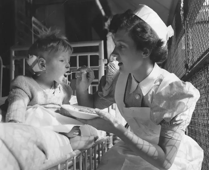 Framed Print : Nurse Feeds Patient Framed Print : Nurse Feeds Patient