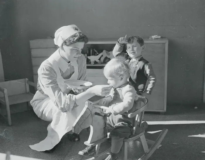 Framed Print : Nurse Giving Vitamins to Children Framed Print : Nurse Giving Vitamins to Children