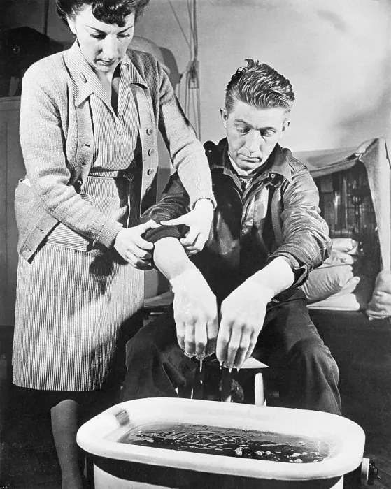 Framed Print : Nurse Helping Frostbite Victim Framed Print : Nurse Helping Frostbite Victim