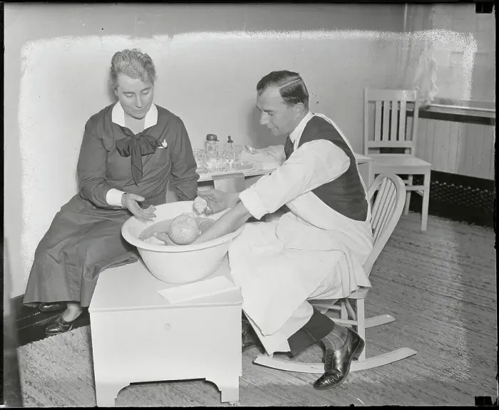 Framed Print : Nurse Instructing Father on Bathing His Baby Framed Print : Nurse Instructing Father on Bathing His Baby