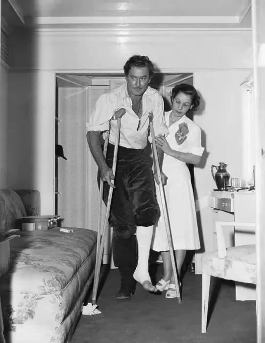 Framed Print : Nurse Visiting Errol Flynn on Crutches Framed Print : Nurse Visiting Errol Flynn on Crutches
