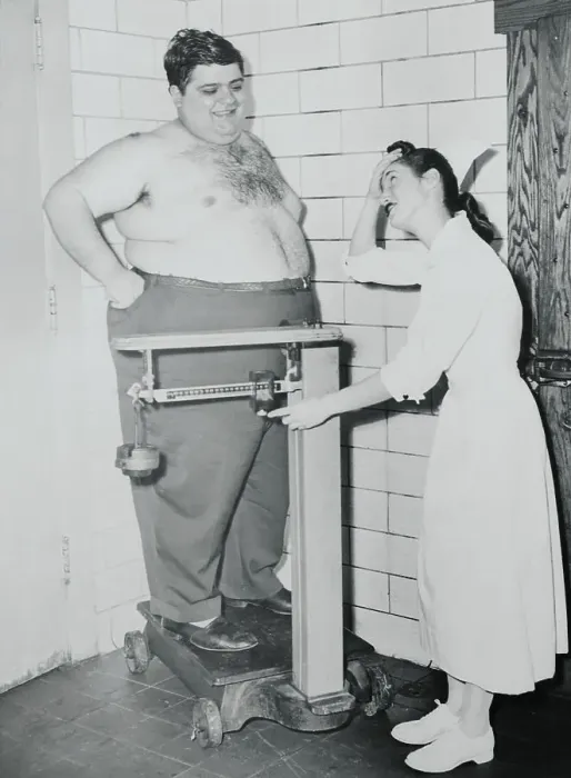 Framed Print : Nurse Weighing Overweight Patient Framed Print : Nurse Weighing Overweight Patient