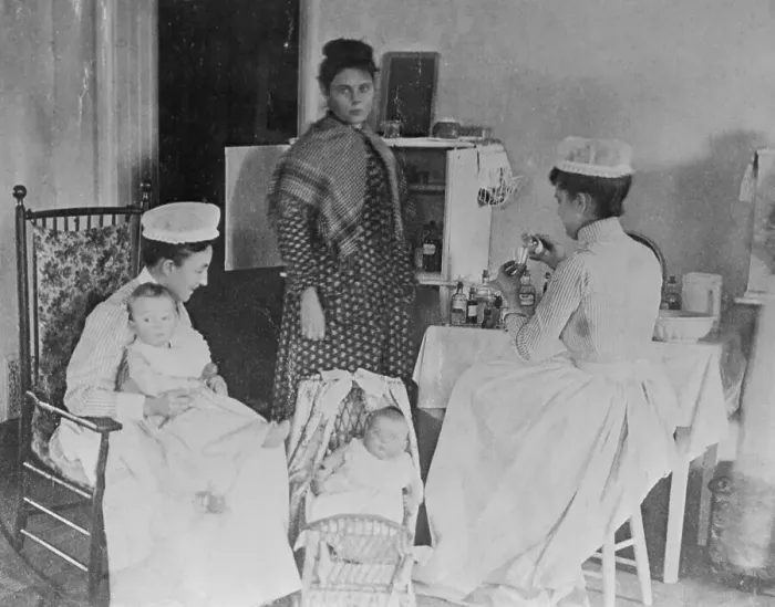 Framed Print : Nurses Caring for Children in Hospital Framed Print : Nurses Caring for Children in Hospital
