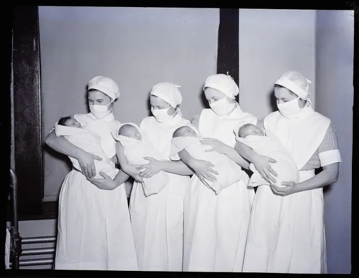 Framed Print : Nurses Holding Babies Framed Print : Nurses Holding Babies