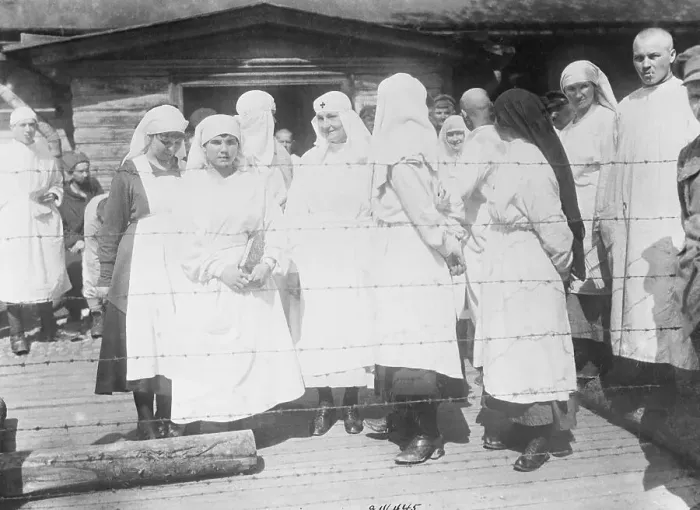 Framed Print : Nurses with Typhus Infected Patients Behind Fence Framed Print : Nurses with Typhus Infected Patients Behind Fence