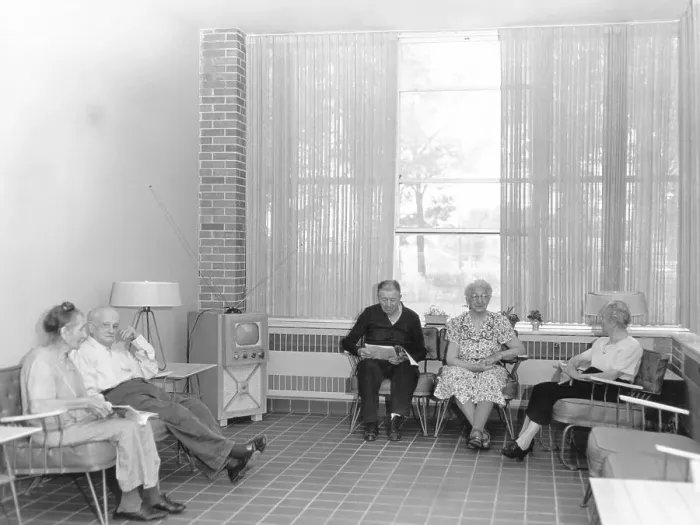 Framed Print : Nursing Home Residents Watch Television in Solarium Framed Print : Nursing Home Residents Watch Television in Solarium