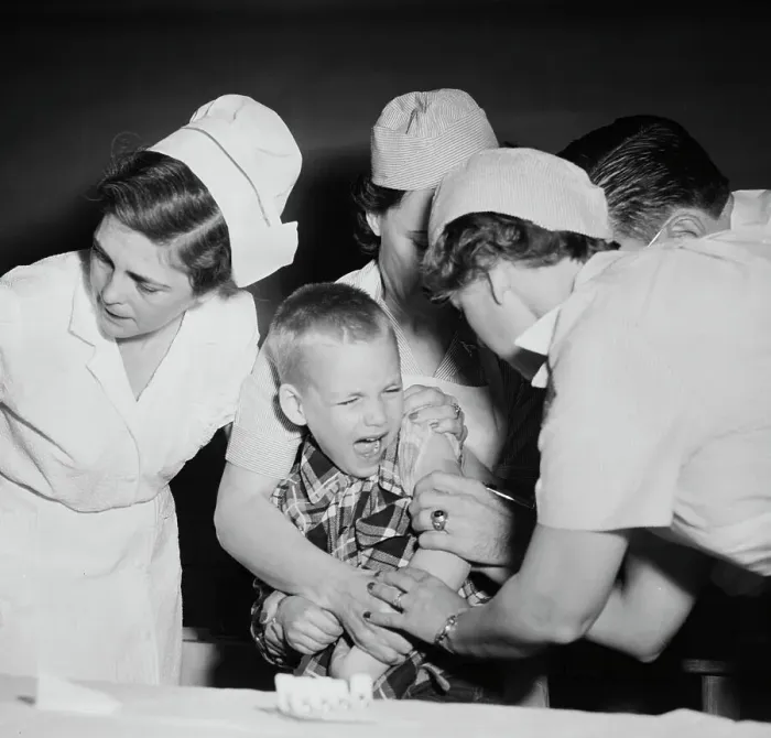 Framed Print : Nursing Staff Members and Doctor Innoculating Young Boy Framed Print : Nursing Staff Members and Doctor Innoculating Young Boy