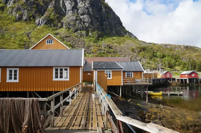 Framed Print : Ochre coloured fishermans huts on the Lofoten Isl Framed Print : Ochre coloured fishermans huts on the Lofoten Isl