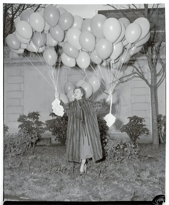 Framed Print : Odette Laure Holding Cluster of Balloons Framed Print : Odette Laure Holding Cluster of Balloons