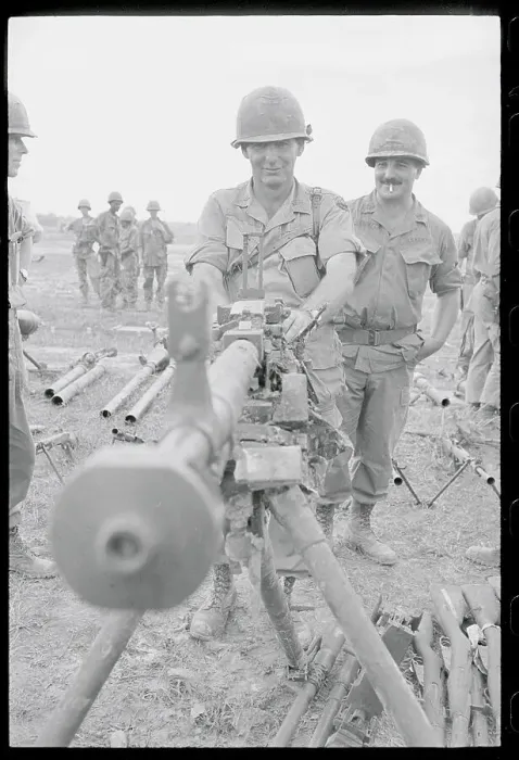 Framed Print : Officer Inspecting Captured Vietcong Machine Gun Framed Print : Officer Inspecting Captured Vietcong Machine Gun