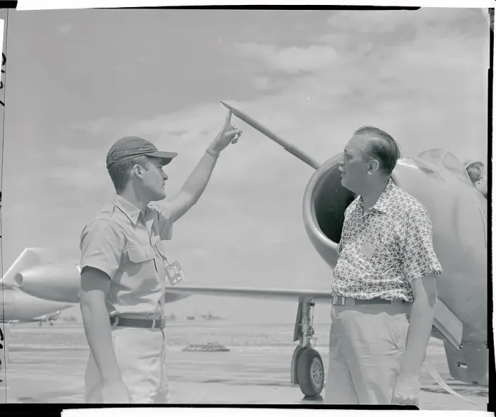 Framed Print : Officer Pointing to a Needle on a Jet Plane Framed Print : Officer Pointing to a Needle on a Jet Plane