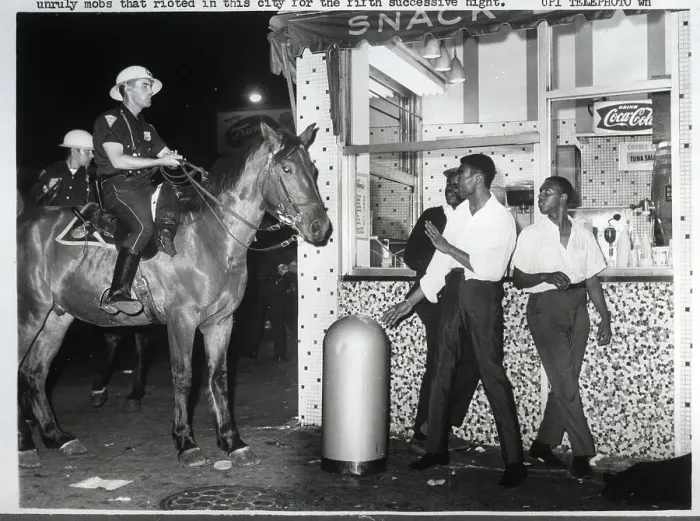 Framed Print : Officers on Horses Confront Men Framed Print : Officers on Horses Confront Men