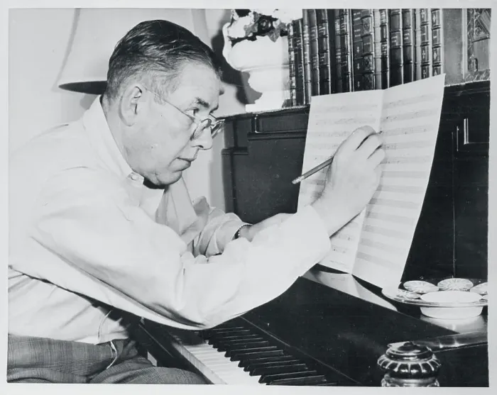 Framed Print : Ogden Nash Writing Lyrics onto Sheet of Music