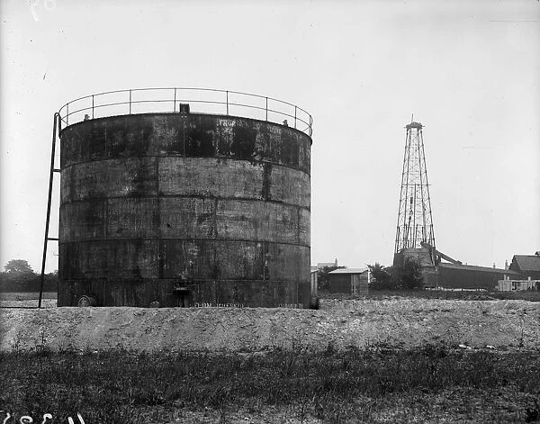 Oil Well. June 1919: Storage tank and derrick at Anglo-Mexican oil wells in Chesterfield