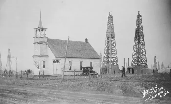 Framed Print : Oil Well Construction Behind Church Framed Print : Oil Well Construction Behind Church