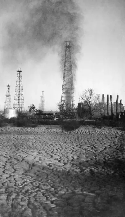 Framed Print : Oil Derrick with Smoke and Oil Shooting Upwards Framed Print : Oil Derrick with Smoke and Oil Shooting Upwards