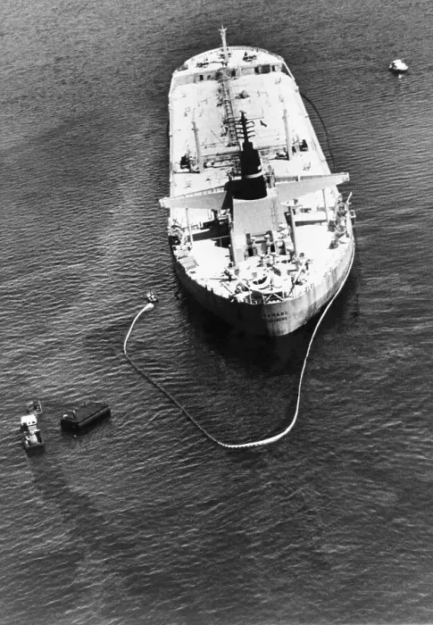 Framed Print : Oil Spill. An oil slick can be seen covering the water around the tanker Tamano Framed Print : Oil Spill. An oil slick can be seen covering the water around the tanker Tamano