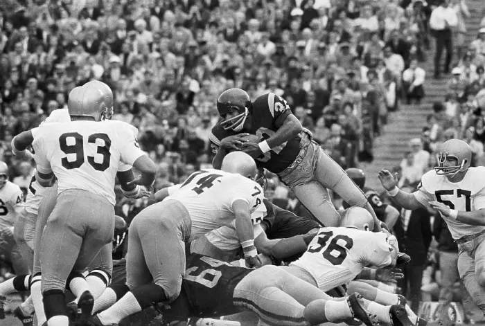 Framed Print : O.J. Simpson in Air as He Jumps over Offensive Line Framed Print : O.J. Simpson in Air as He Jumps over Offensive Line