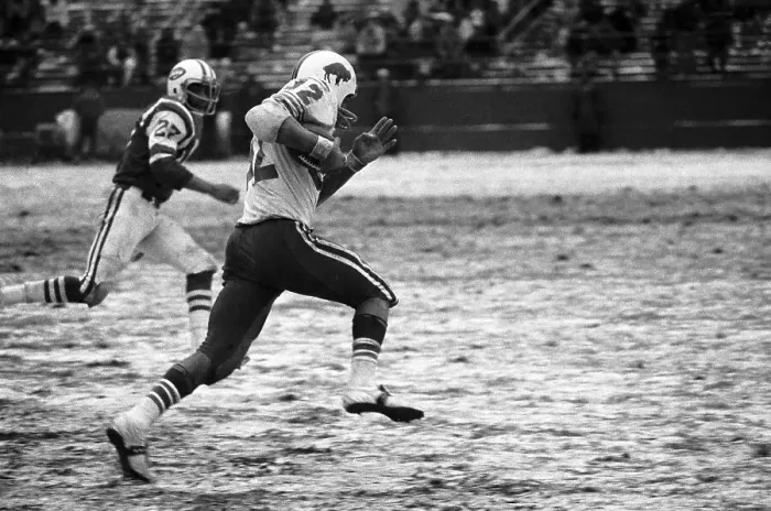 Framed Print : O.J. Simpson Flies Past the Jets Defense