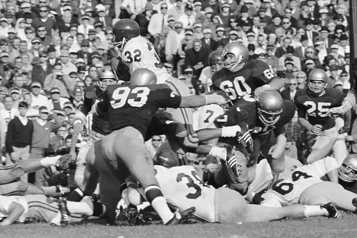 Framed Print : O.J. Simpson Goes Over the Notre Dame Defense Framed Print : O.J. Simpson Goes Over the Notre Dame Defense