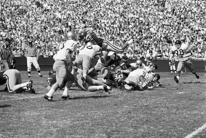 Framed Print : O.J. Simpson Goes Over Opposing Team Framed Print : O.J. Simpson Goes Over Opposing Team
