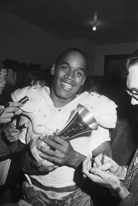 Framed Print : O.J. Simpson Holding Player of the Game Trophy Framed Print : O.J. Simpson Holding Player of the Game Trophy