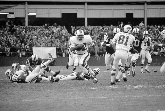 Framed Print : O.J. Simpson Running by the Jets Defense Framed Print : O.J. Simpson Running by the Jets Defense