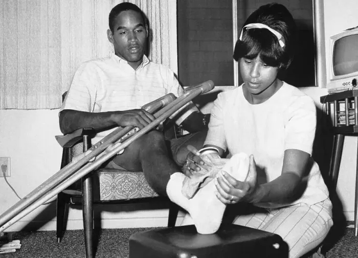 Framed Print : O.J. Simpson's Wife Applies an Ice Pack to His Foot Framed Print : O.J. Simpson's Wife Applies an Ice Pack to His Foot