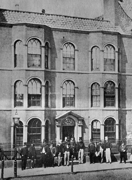 Old Bank. 1860: A group of men stand outside Backhouses Bank, London