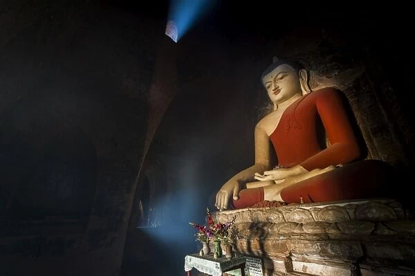 Old buddha statue in the ruins of Bagan pagoda