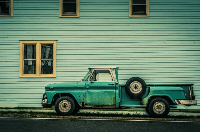 Framed Print : Old Green Truck against Green Building Framed Print : Old Green Truck against Green Building