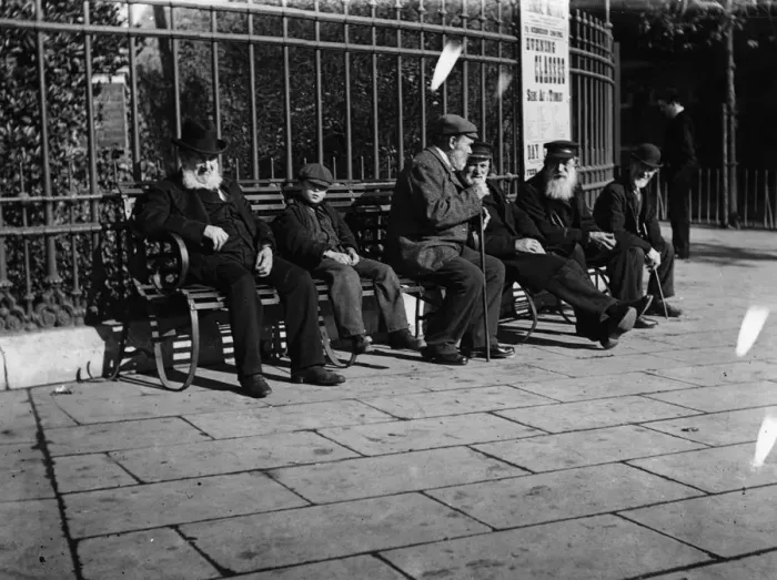 Framed Print : Old Men. circa 1900: A young boy sits on a bench next to a group of old Framed Print : Old Men. circa 1900: A young boy sits on a bench next to a group of old