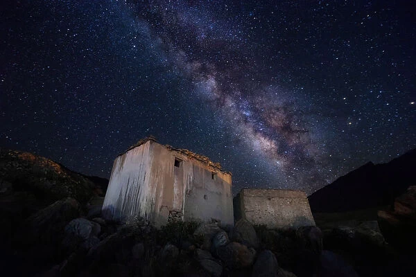 Old ruins of Tibetan monastery and the milky way